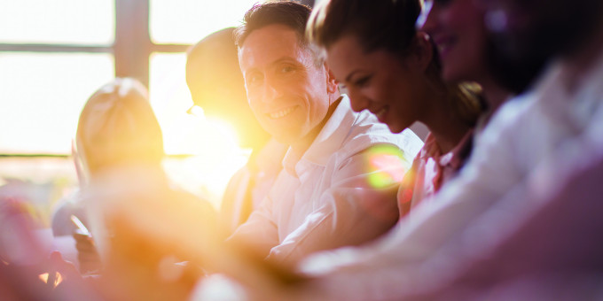 Man smiling during meeting