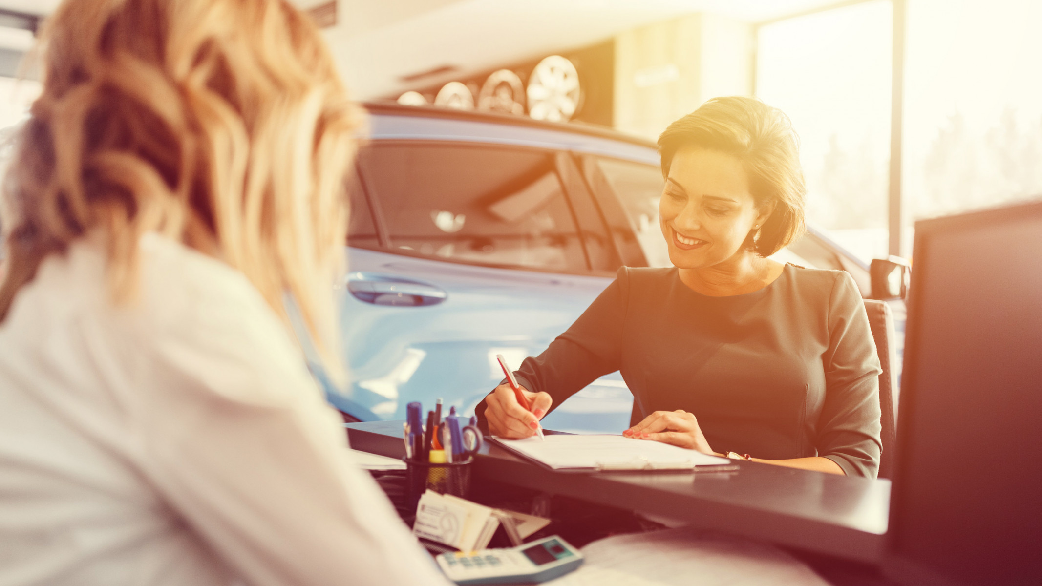 Women in car dealership
