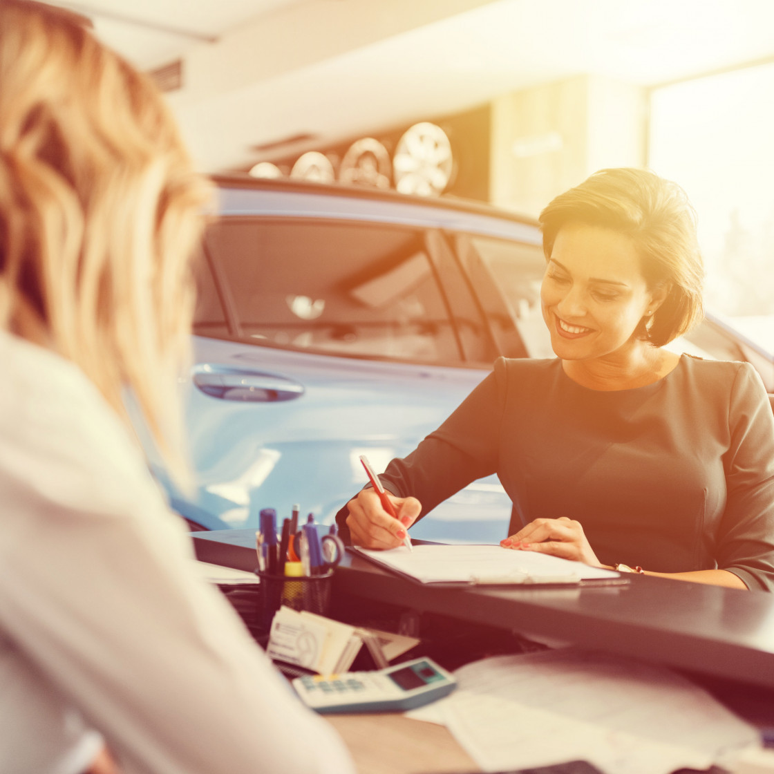 Women in car dealership